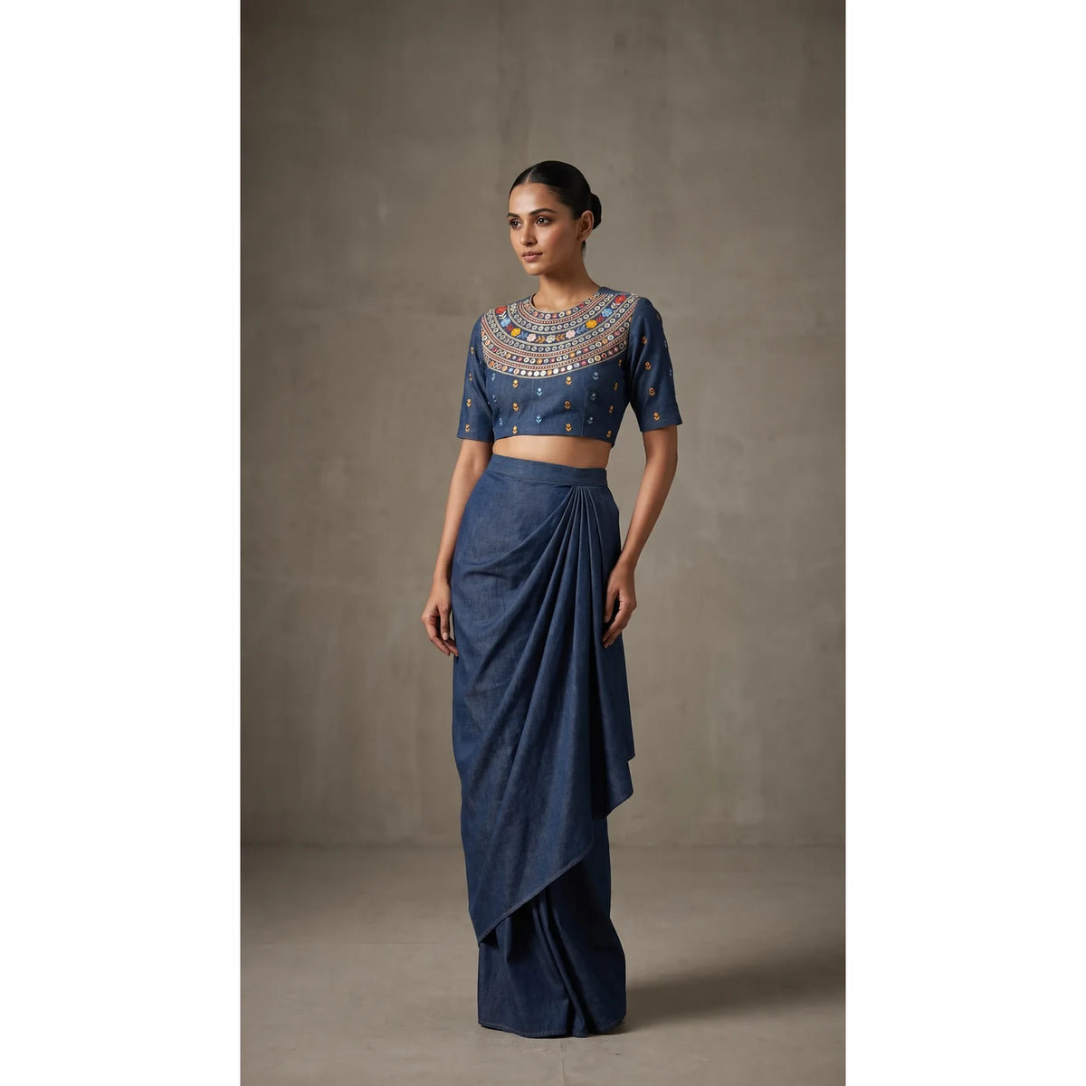 Blue denim draped skirt set with heavily hand-embroidered mirror work blouse, full front view