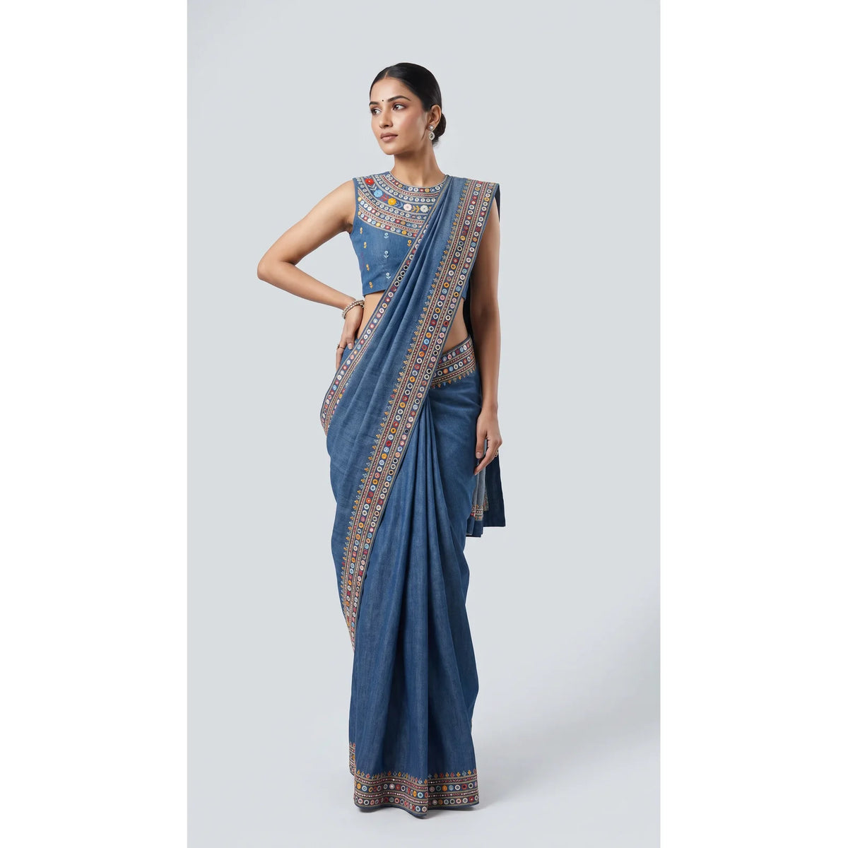 Blue cotton denim saree and sleeveless embroidered blouse with mirror work, full front view