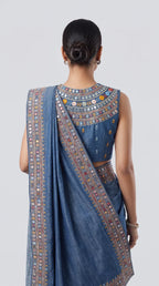 Back view of blue denim saree set showing embroidered blouse and mirror work border — thumbnail 3
