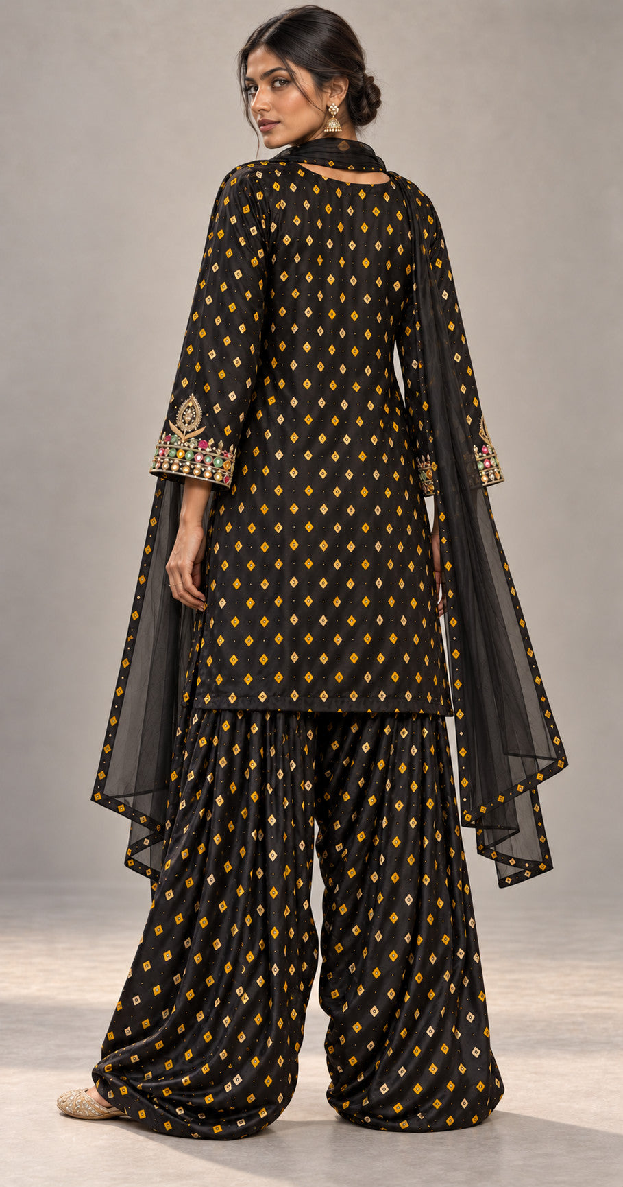 Back view of black bandhani modal silk kurta and farshi salwar