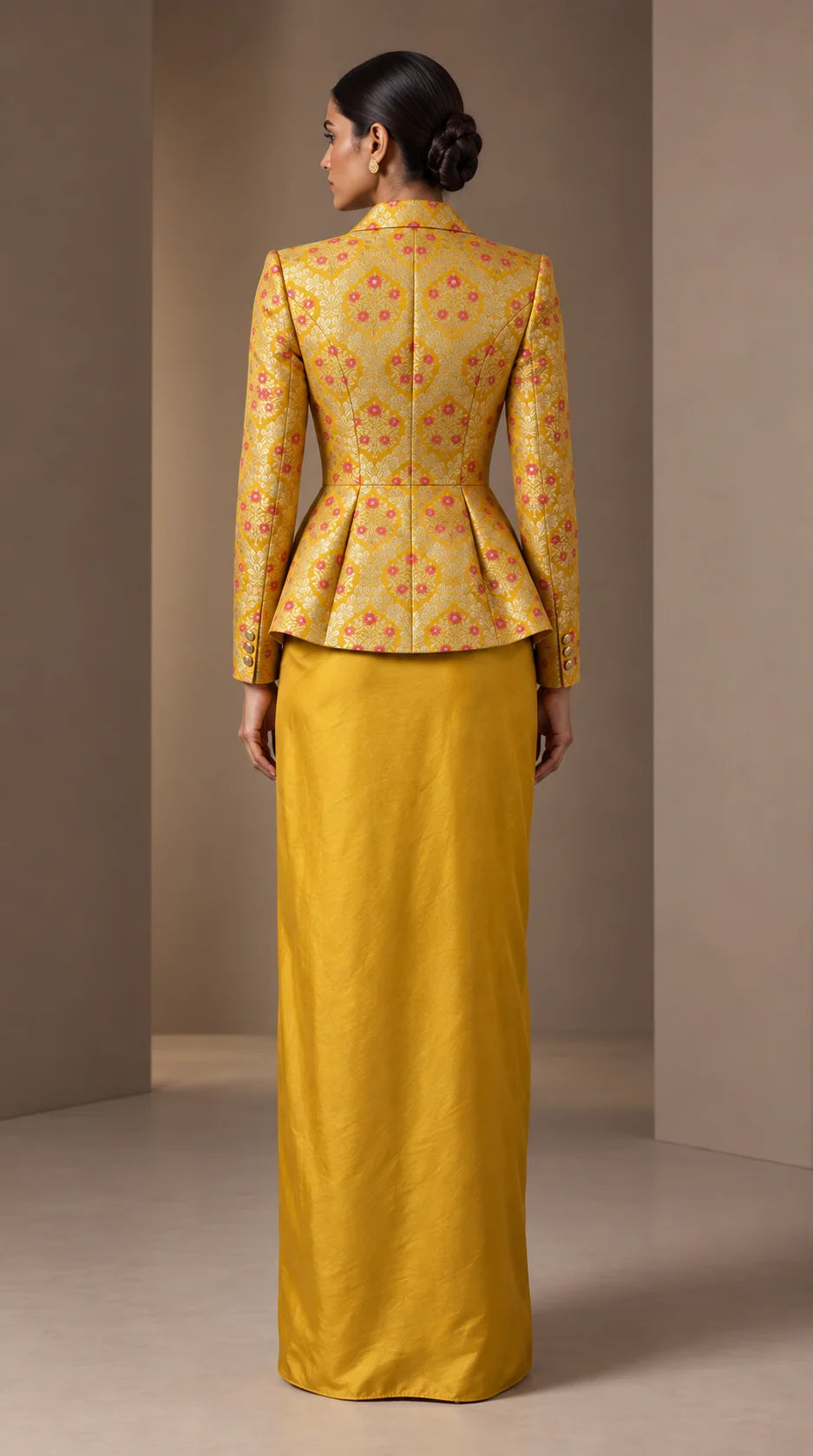 ZAREEN marigold yellow brocade peplum blazer and draped skirt set, back view with smooth unpleated skirt