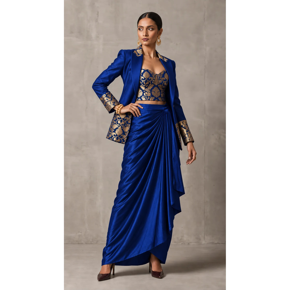 Royal Blue Banarasi Katan silk brocade three-piece set with modal silk blazer and draped skirt, full-length front with blazer; full photograph centered on a square white canvas