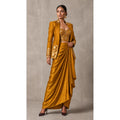Ochre Gold Banarasi Katan silk brocade three-piece set with modal silk blazer and draped skirt, full-length front with blazer; full photograph centered on a square white canvas