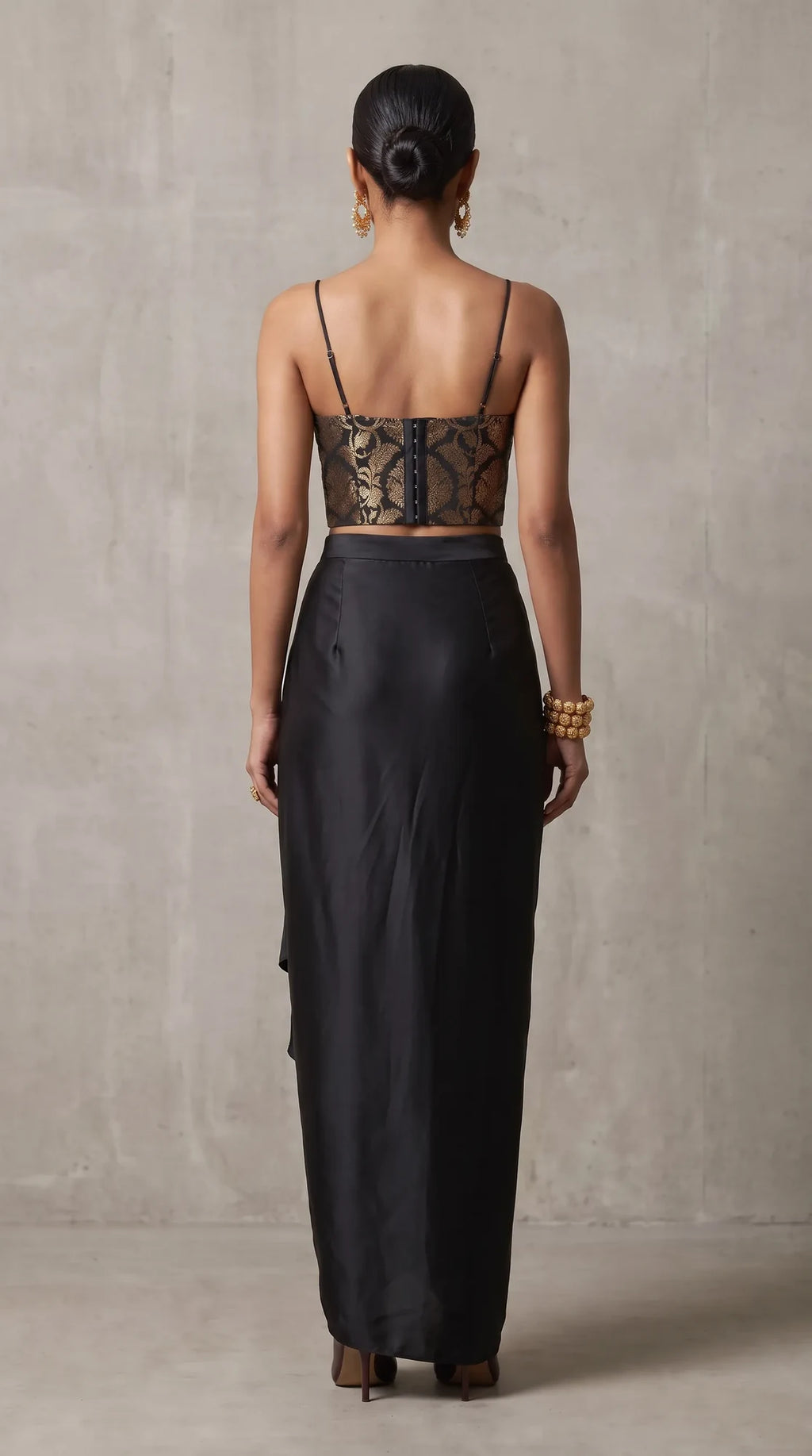 Black Banarasi Katan silk brocade three-piece set with modal silk blazer and draped skirt, back view without blazer
