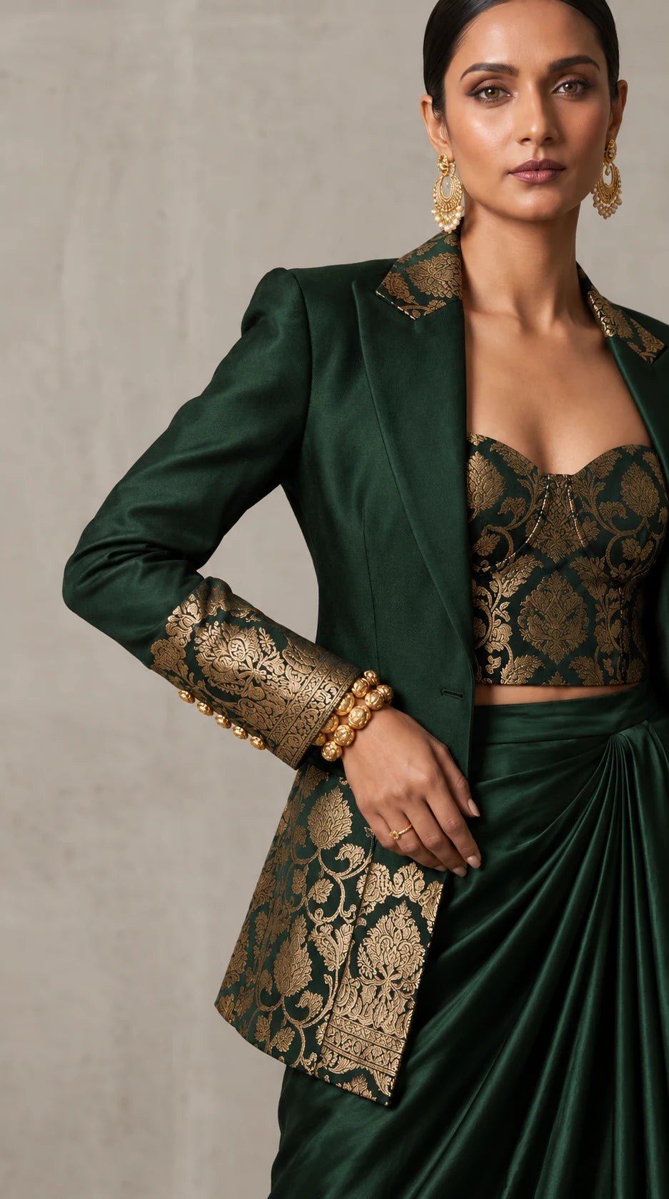 Deep Green Banarasi Katan silk brocade three-piece set with modal silk blazer and draped skirt, brocade and blazer cuff detail